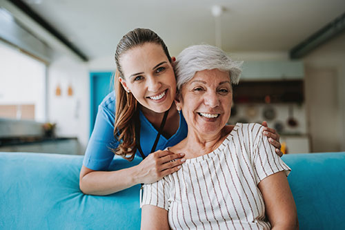 a health care worker hugging a patient